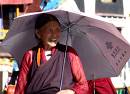  happy tibetan women walking the barkhor kora, lhasa