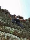  climbing around one of the temples of angkor thom